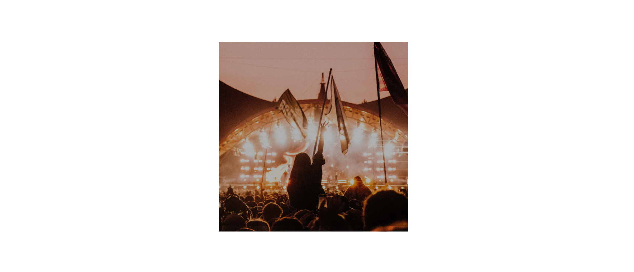 Orange Shift — festival main stage at dusk, flags & crowd